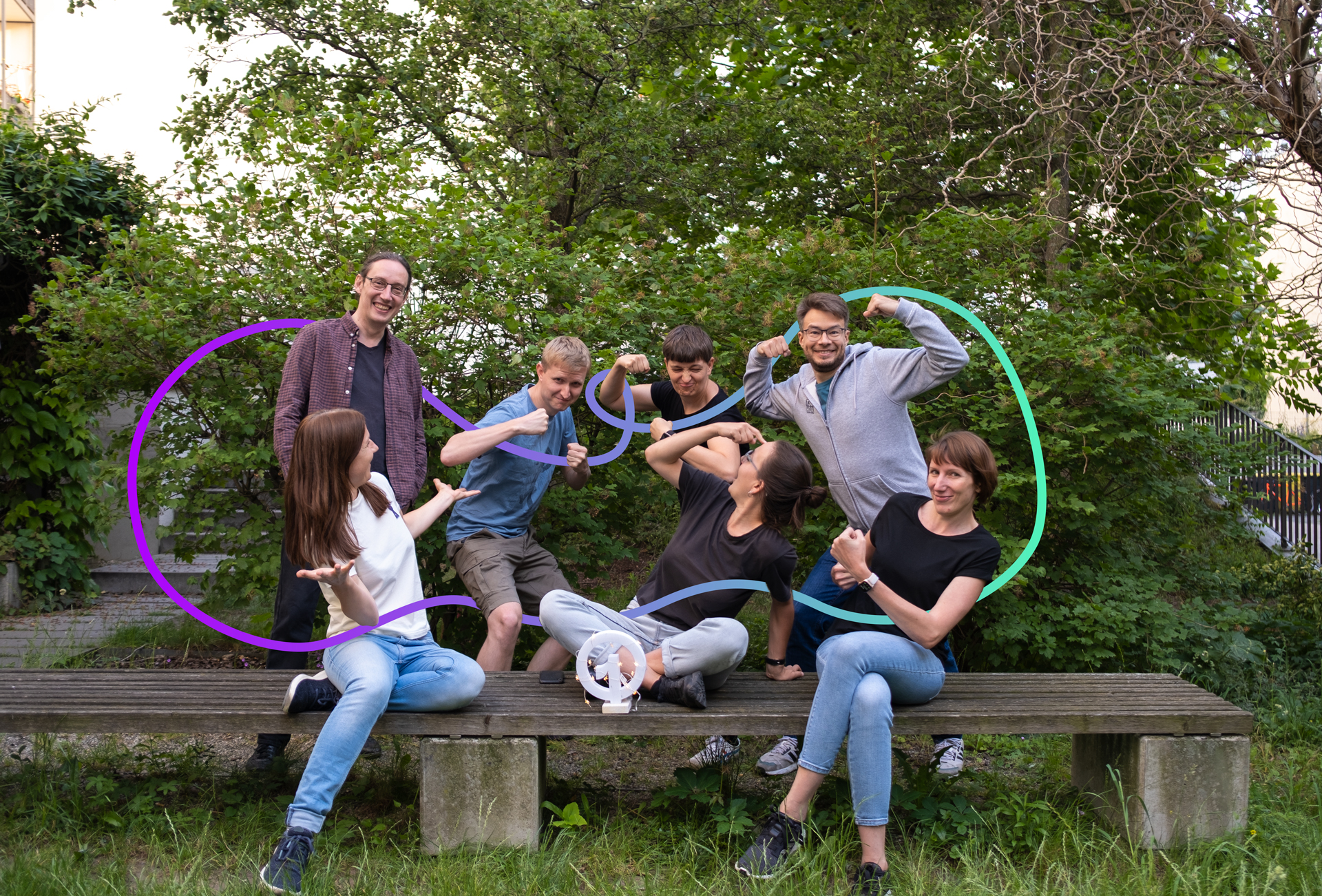 the seven members of the core team having fun taking a team photo